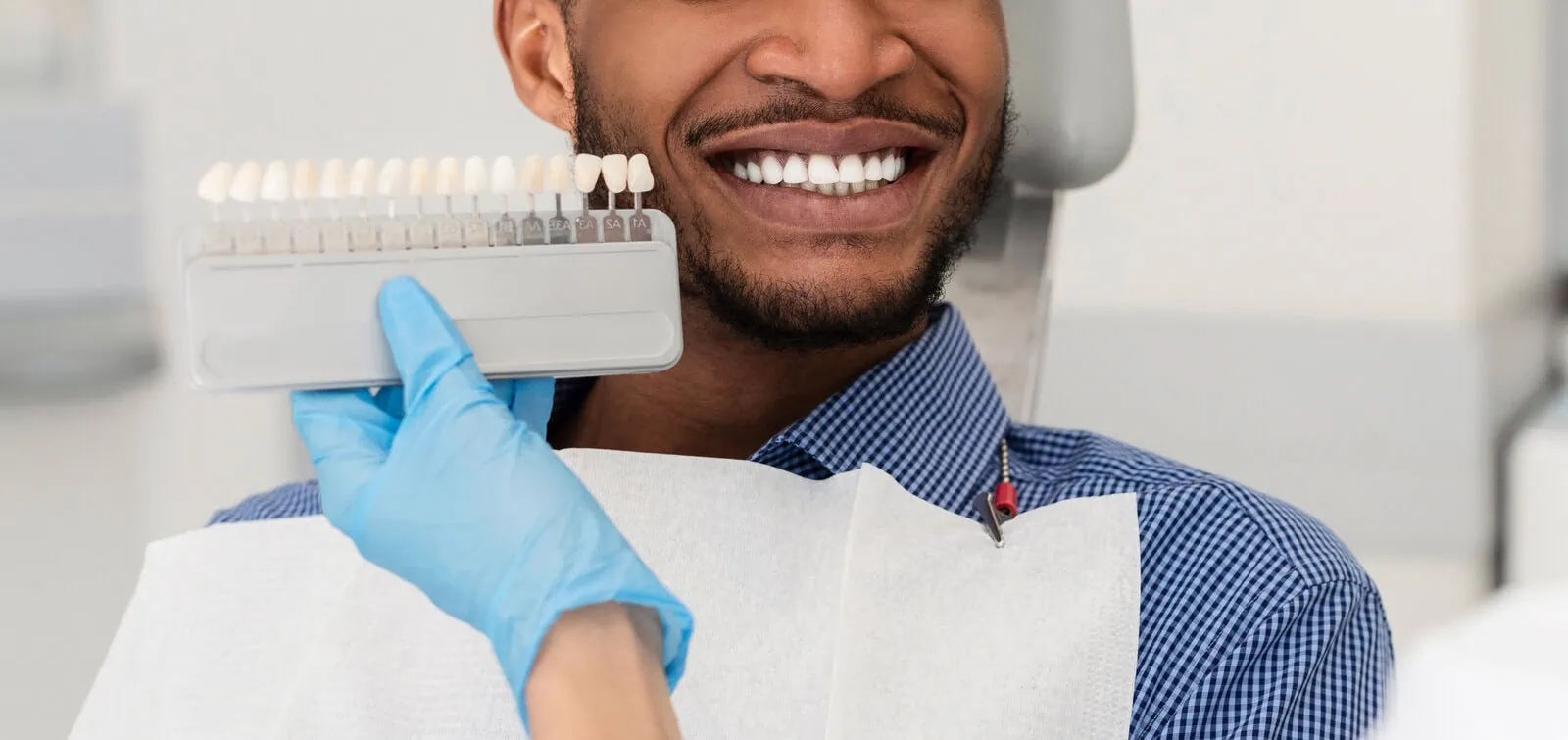 Dentist reviewing root canal treatment plan and insurance coverage with patient