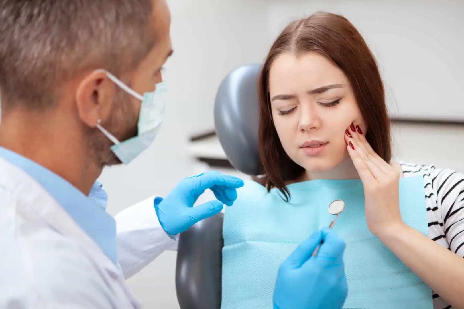 Dentist providing emergency care to a patient in Ridgewood, NJ